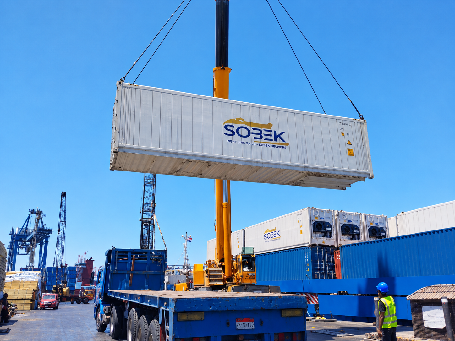 Sobek container hanging above a blue truck